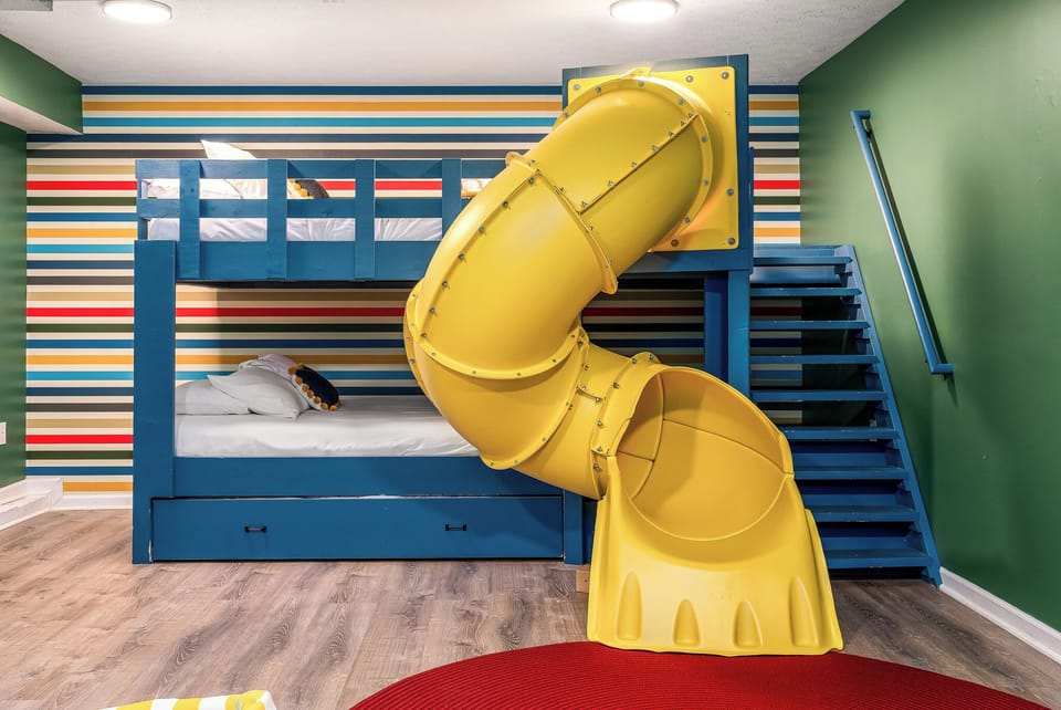 bunk room with tube slide