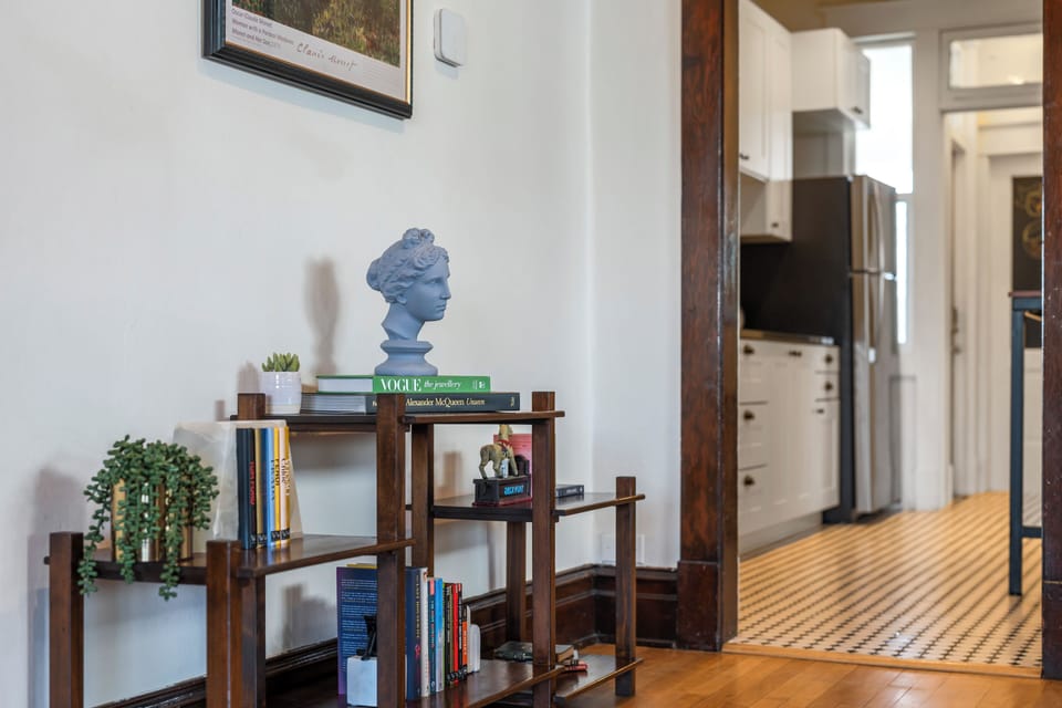 Unwind with some light reading!  View looking into the kitchen 