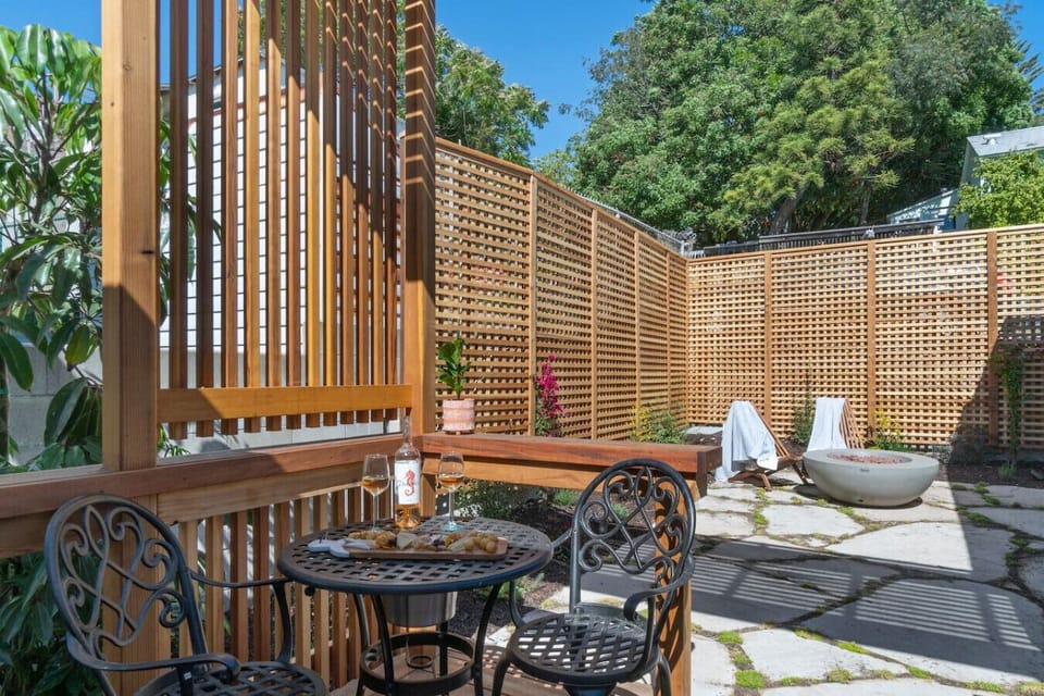 Private patio with bistro seating and a fire bowl