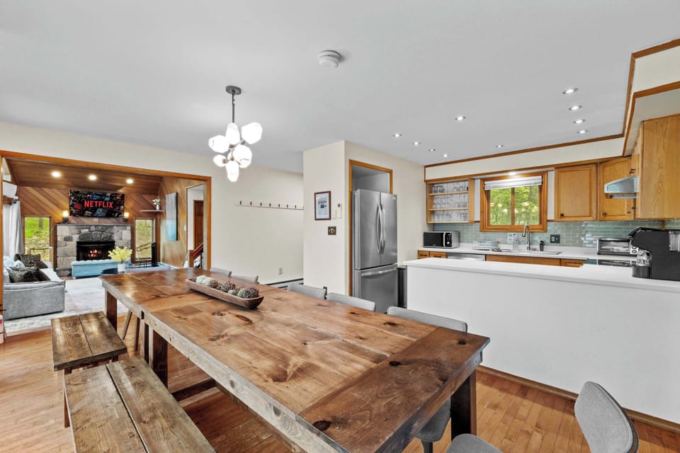 Gather around the stylish table with stunning woodland views—meals become memories!