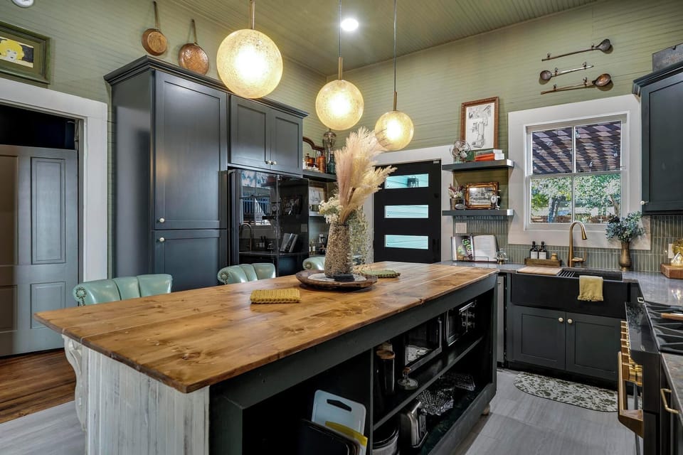 Cook and gather in this beautifully designed kitchen, featuring modern amenities and a spacious island perfect for entertaining. With a perfect balance of contemporary style and vintage charm, it’s an ideal space for preparing meals and enjoying good company.