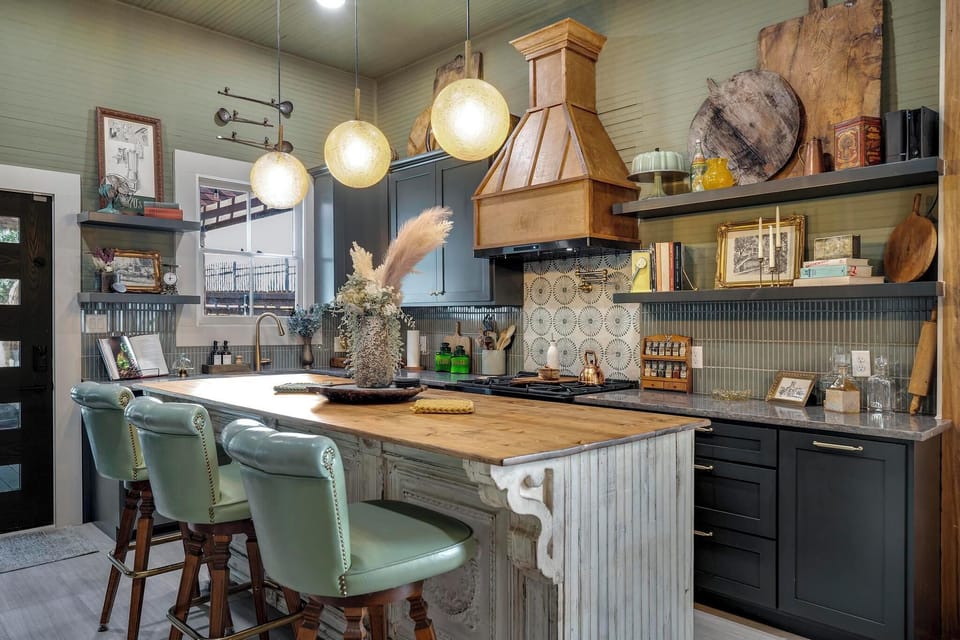 Chef-inspired kitchen, featuring a stunning 6-burner gas stove, custom cabinetry, and stylish open shelving. The perfect blend of form and function, this space invites you to cook, dine, and relax in style.