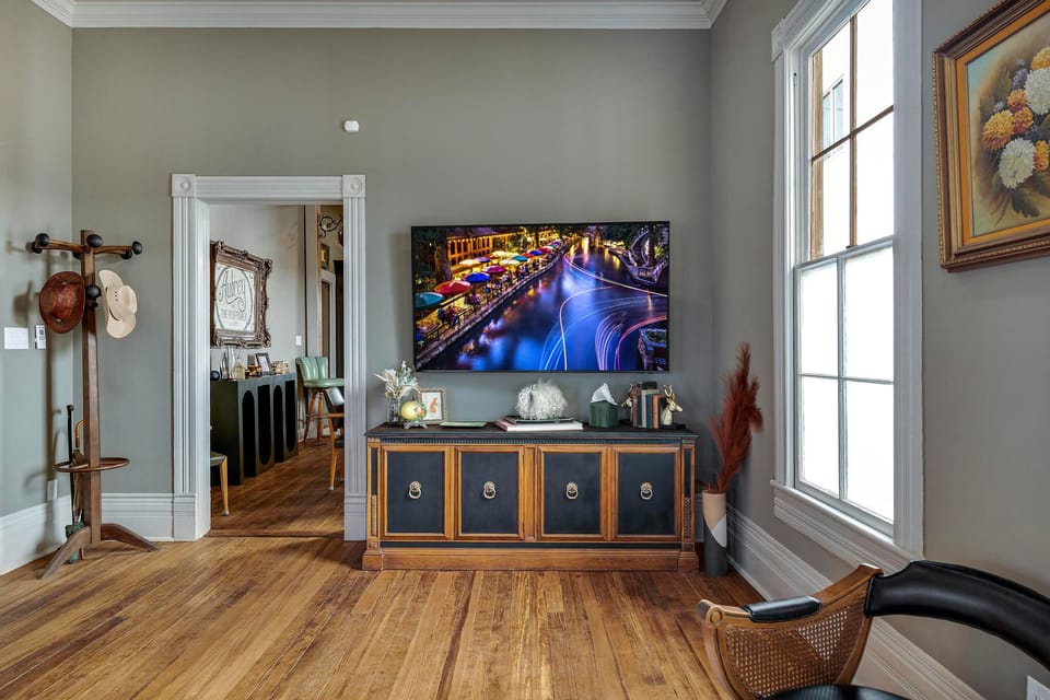 65-inch TV perfect for streaming your favorite shows or movies. For a fun, unplugged evening, explore the selection of board games tucked away in the entertainment center’s cabinets.