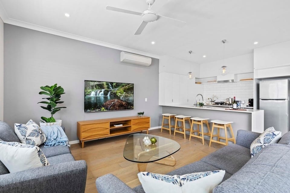 Kitchen, lounge, smart TV and patio doors in one easy open-plan space.
