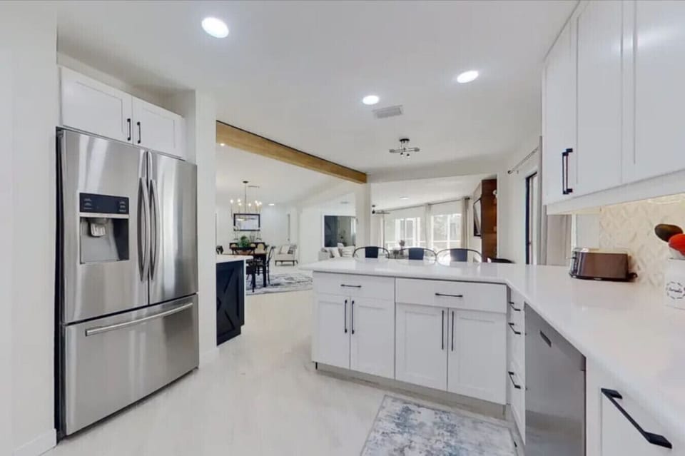 Contemporary kitchen with stainless steel refrigerator