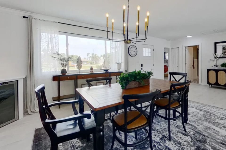 Farmhouse contemporary dining room seats 6 with modern fixtures