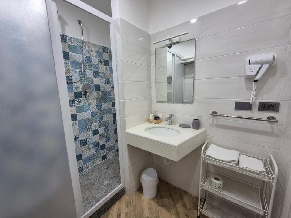 Classic Triple Room, Balcony, Hill View | Bathroom | Shower, hair dryer, slippers, towels