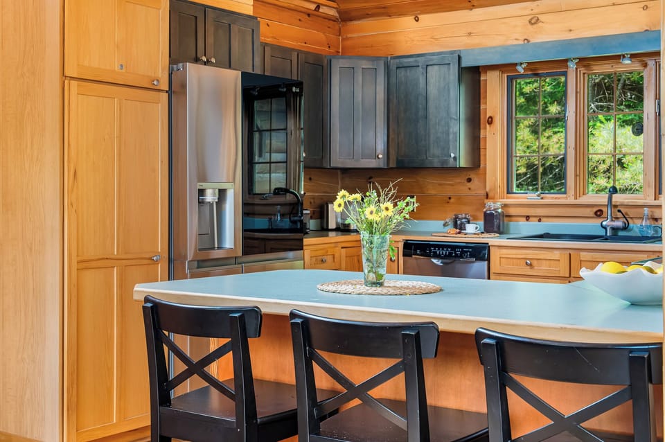 A fully stocked kitchen with a coffee bar including teas, k-cups, ground coffee and more