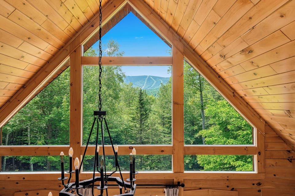 Off the main living space, head up the stairs to the small loft for stunning views of Sunday River.