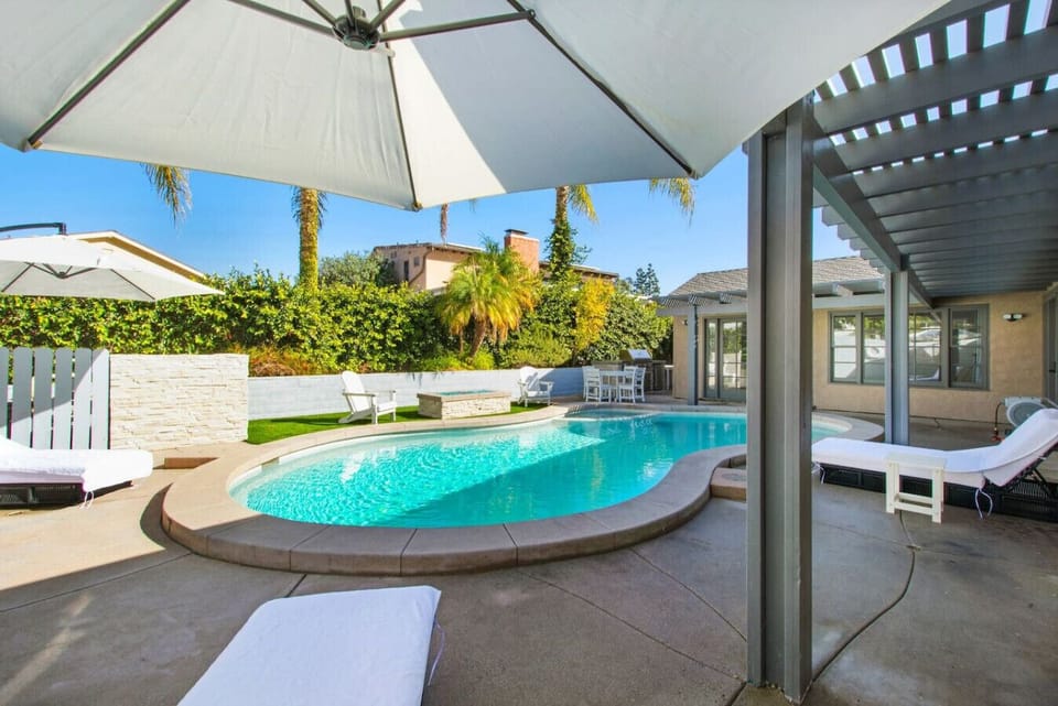 Enjoy sunny days lounging by the pool, unwinding in the soothing spa