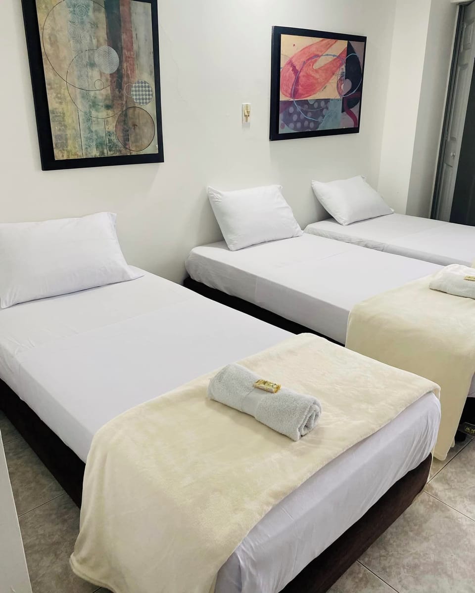 Junior Triple Room | Blackout drapes, iron/ironing board, free WiFi, bed sheets