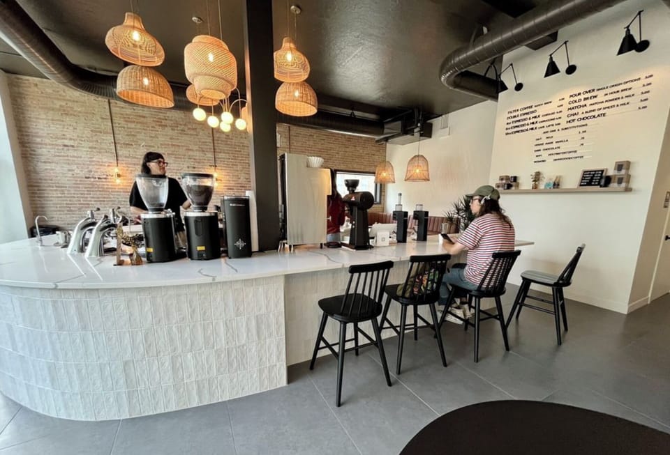 Holy Water Coffee and Bites, just a quick 3 minute walk.  An easy 0.1 mile!