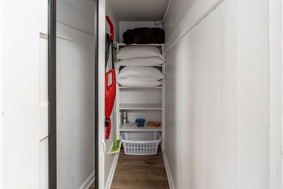 Closet 2 in bedroom, iron, extra pillows/blankets, laundry supplies-laundry pods