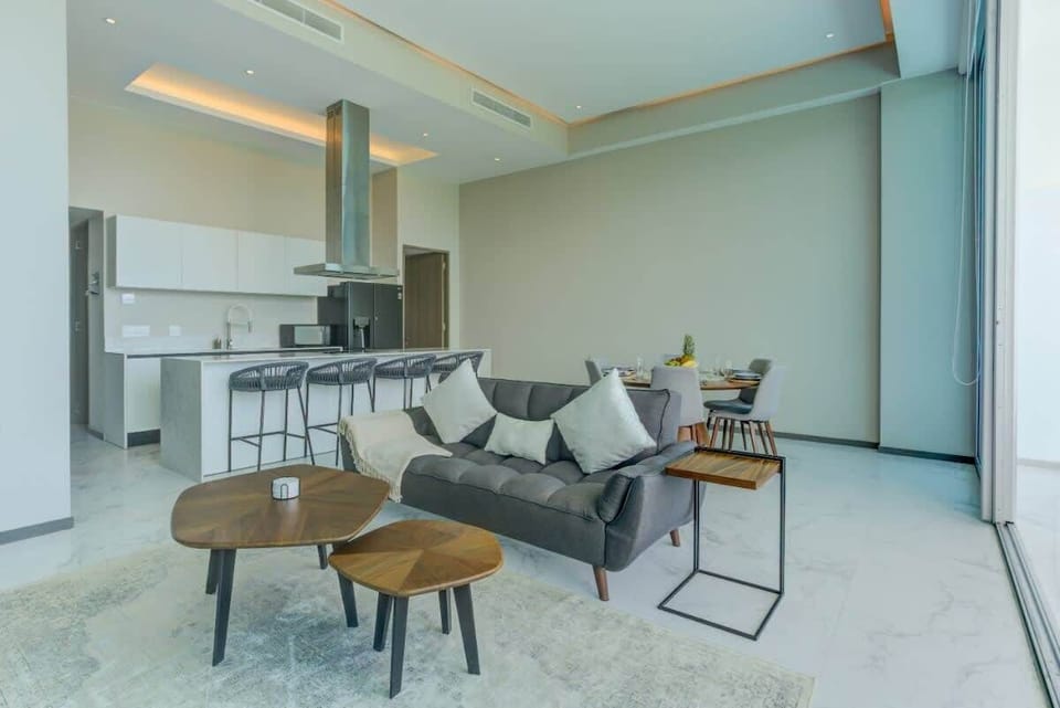 A cozy sofa and nature-chic furniture in the sitting space