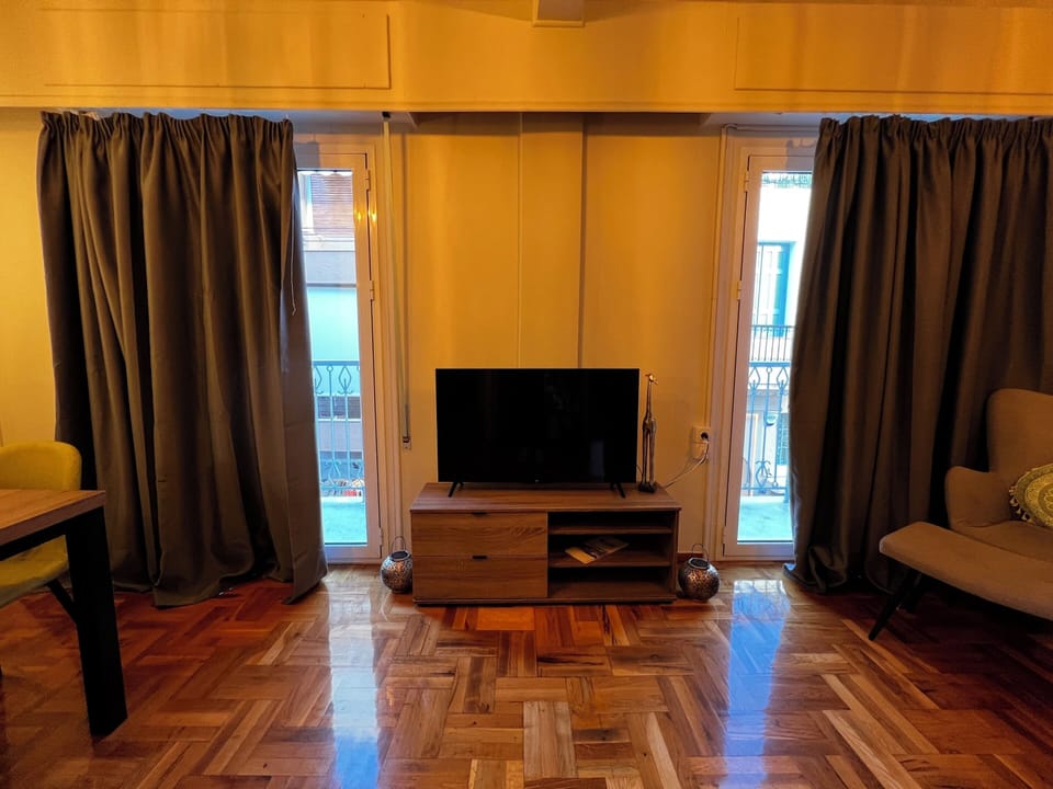 Apartment, City View | Living area | 40-inch flat-screen TV with digital channels