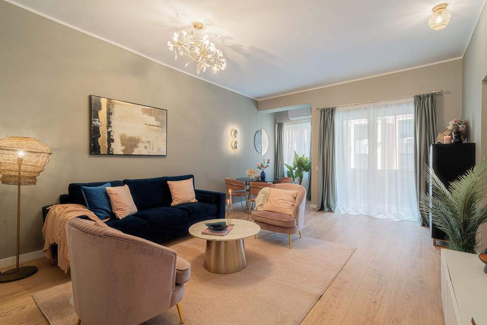 Deluxe Apartment, 2 Bedrooms, Balcony, City View | Living room | 42-inch Smart TV with cable channels, Netflix, streaming services