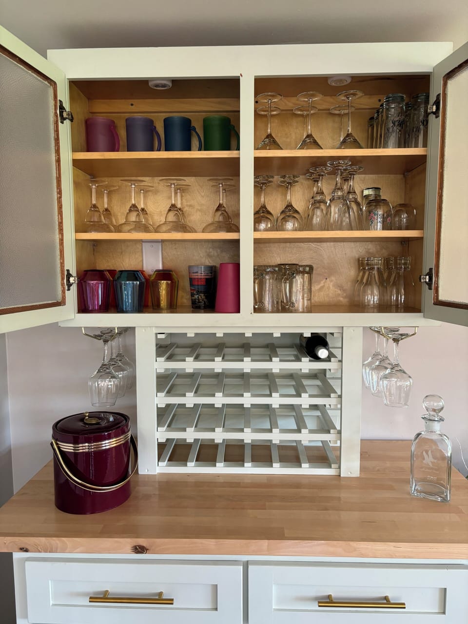 Our well stocked bar. Plenty of glassware, bottle opener, & wine bottle storage.