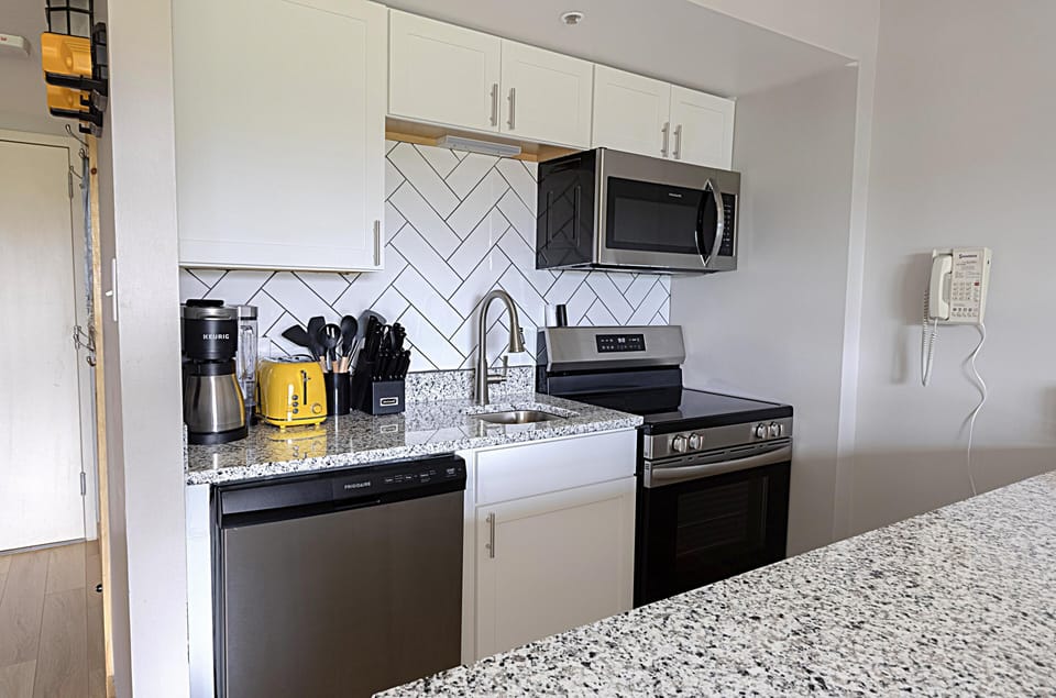 The modern, fully equipped kitchen is perfect for preparing anything from a quick snack to a gourmet meal.