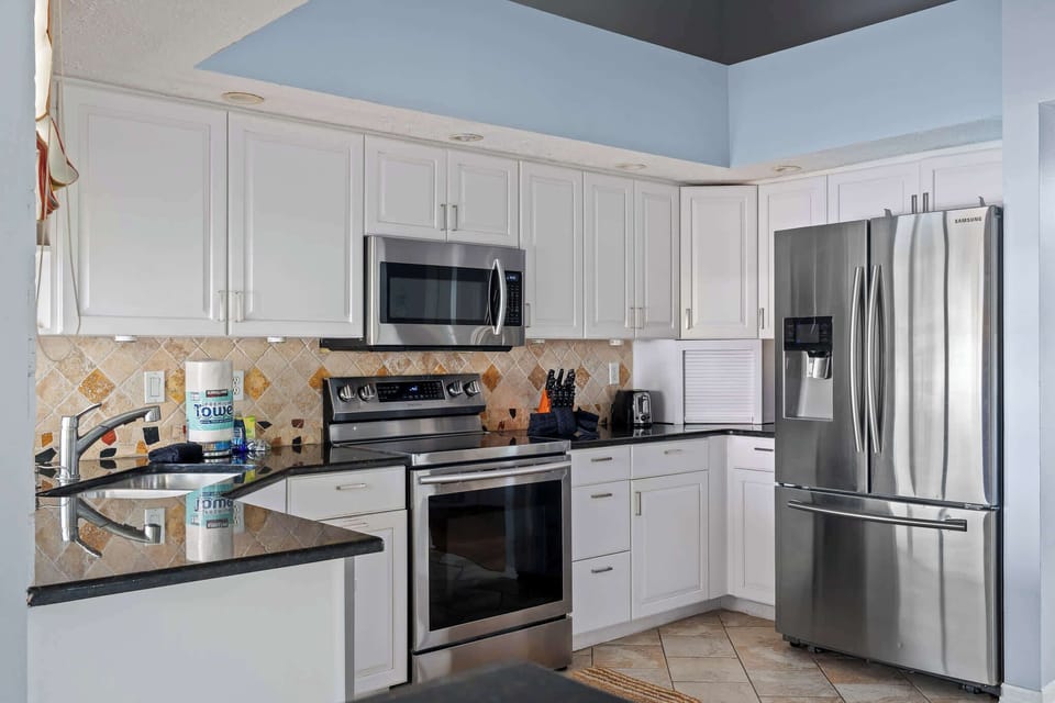 A Chef’s Dream! This fully equipped kitchen features modern appliances and ample space, perfect for cooking up your favorite meals.