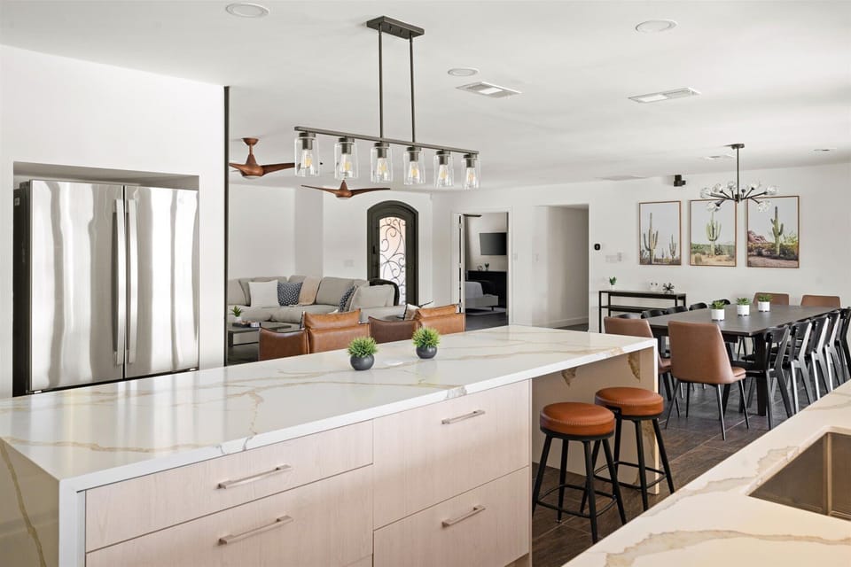 Kitchen bartop with seating for 4, open to dining and living spaces — great for social cooking and casual meals.