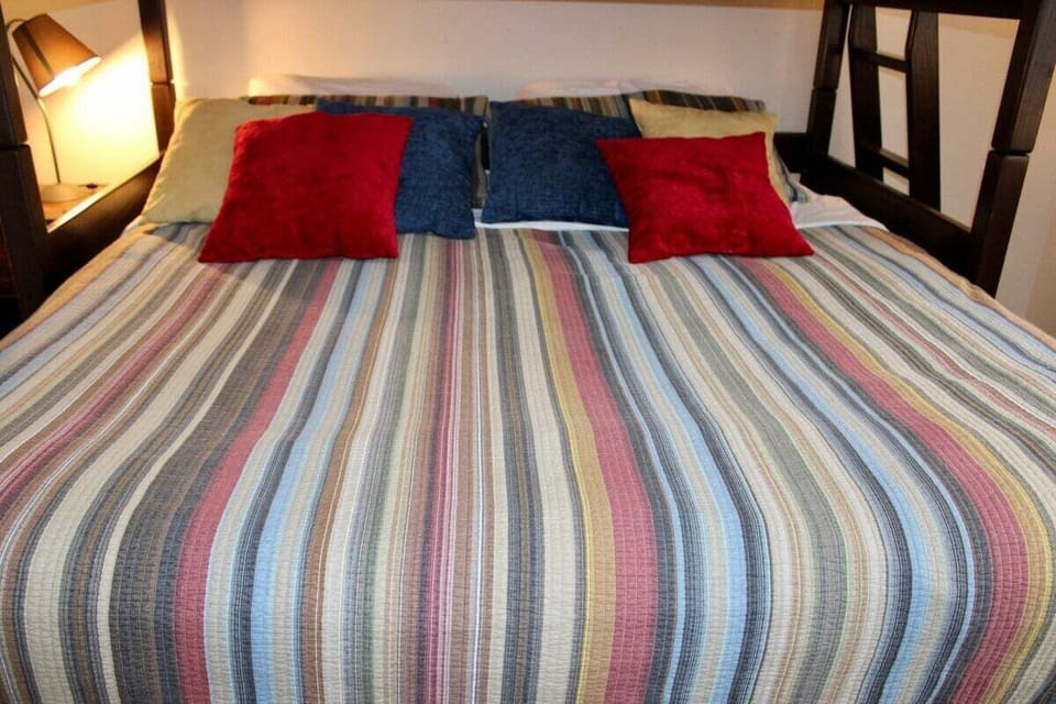 This close-up shows the lower bed beneath the upper bunk.