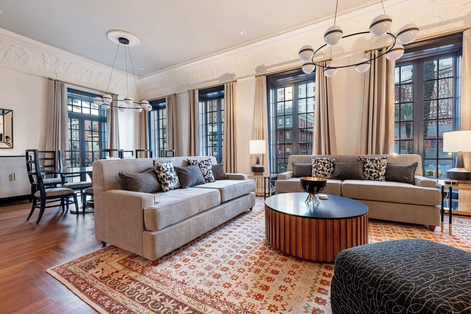 Step back into the glamour of the 1920s in this former dance hall, beautifully restored with original crown molding and enhanced by breathtaking views of Canal Street.