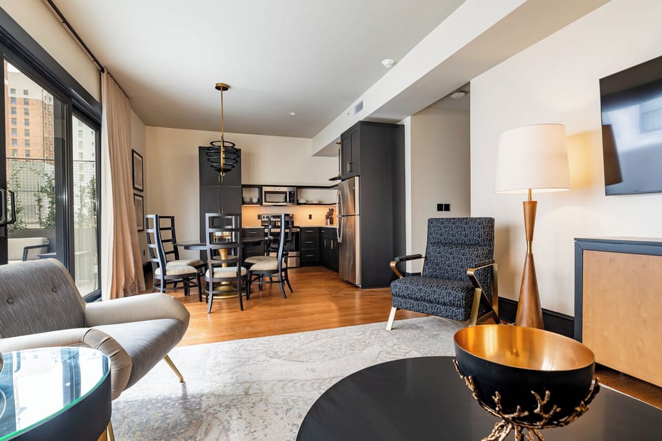 Experience luxury in this penthouse suite with its stylish open layout, contemporary furnishings, and private patio—perfect for elevated city living.