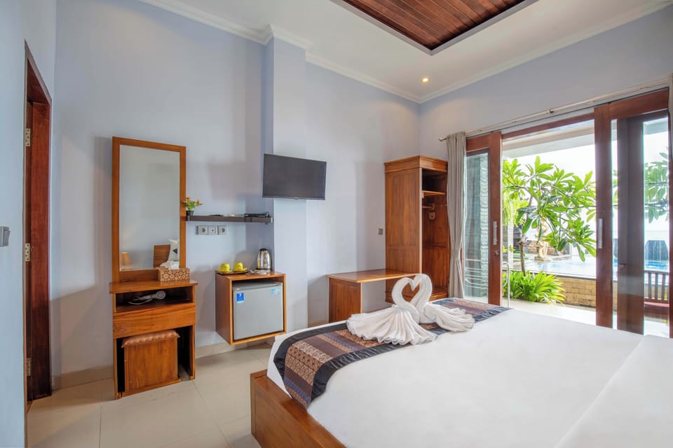 Deluxe Double Room, Patio, Pool View | Minibar, free WiFi, bed sheets