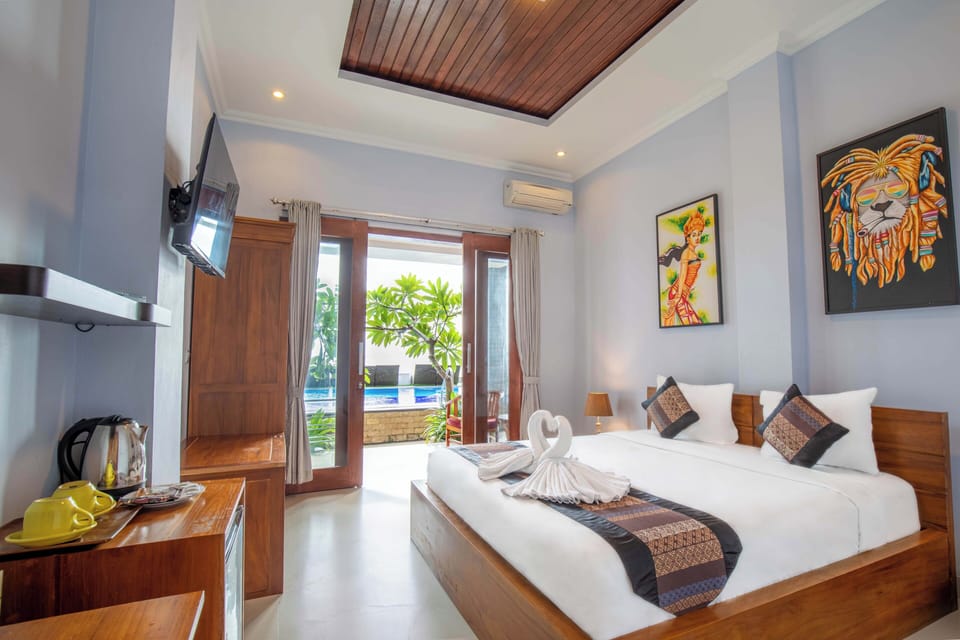 Deluxe Double Room, Patio, Pool View | Minibar, free WiFi, bed sheets