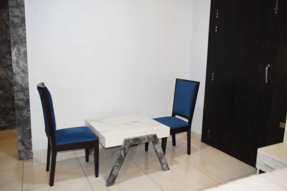 Executive Double Room | Living area | 52-inch LED TV with satellite channels