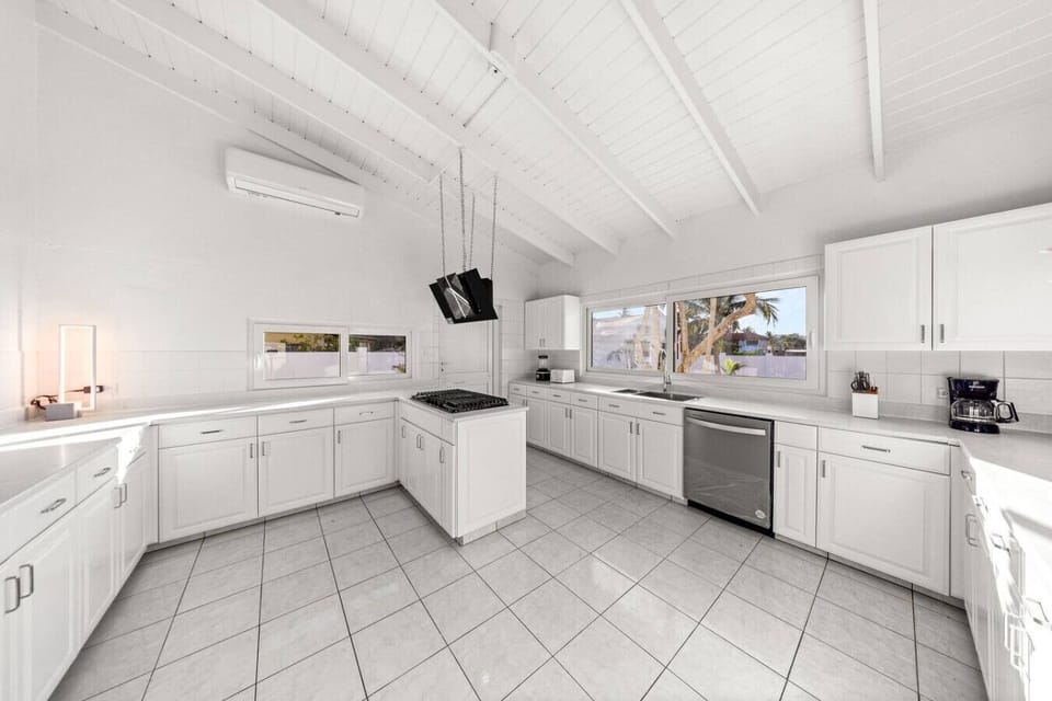 A gourmet chef`s dream, the fully equipped kitchen boasts high-end appliances, a stylish island with bar seating, and everything you need for home-cooked meals or quick snacks.