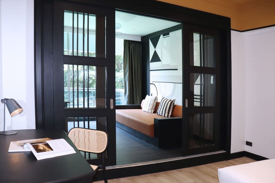 Junior Triple Suite Room | Living area | 50-inch Smart TV with digital channels