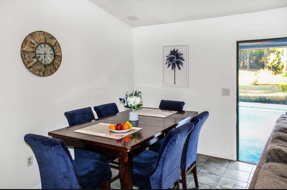 Enjoy meals and cozy evenings in this inviting dining and living area, designed for comfort and connection