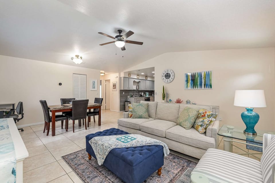 Spacious living room, dining room, dedicated workspace, and kitchen