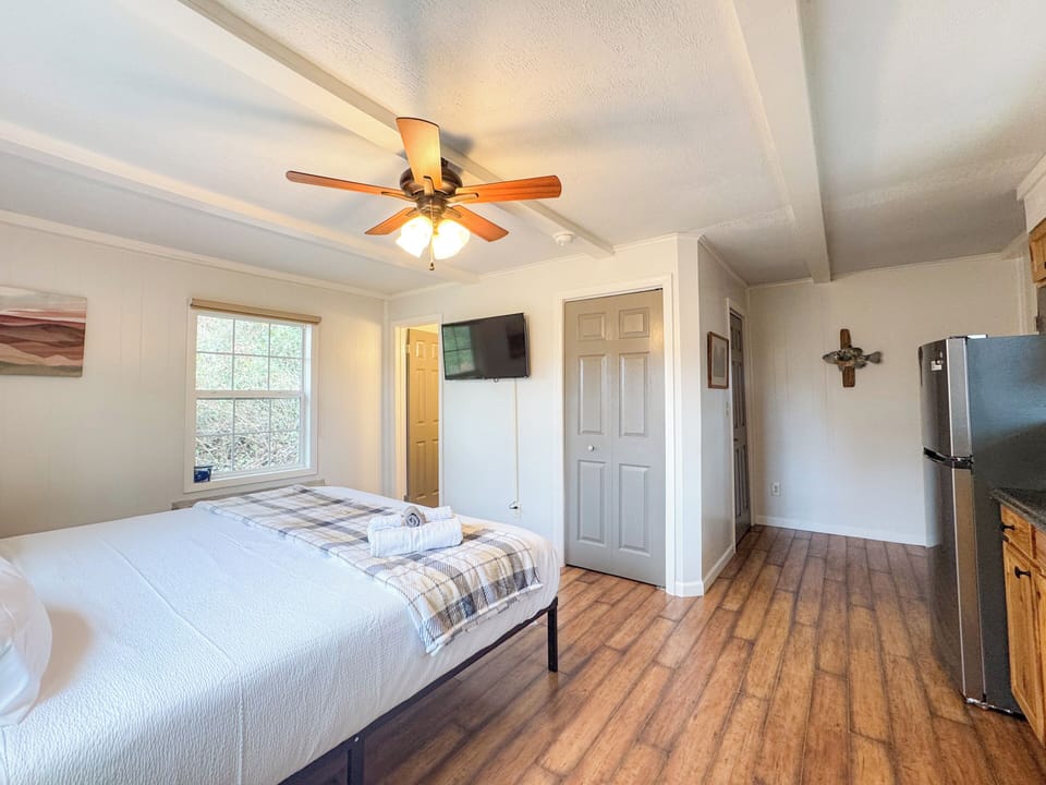 The separate apartment suite features a comfy King size bed with cooling memory foam gel and high thread count bedding. There is a smart TV, a small ensuite bathroom, refrigerator, coffee maker, and some kitchen items. Mostly for drinks and such.