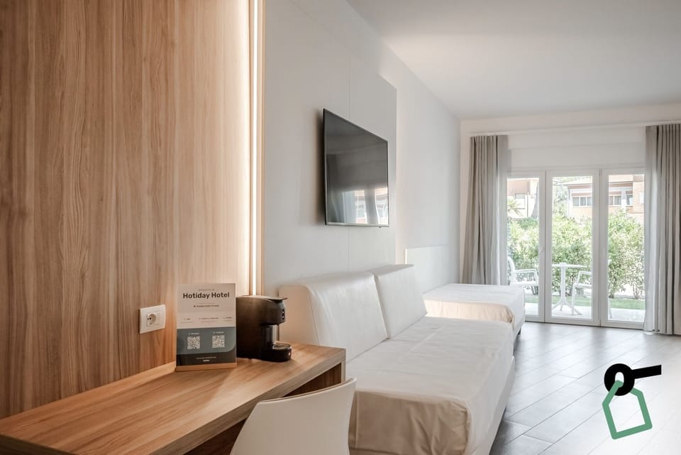 Comfort Quadruple Room, Patio | Minibar, in-room safe, desk, cribs/infant beds