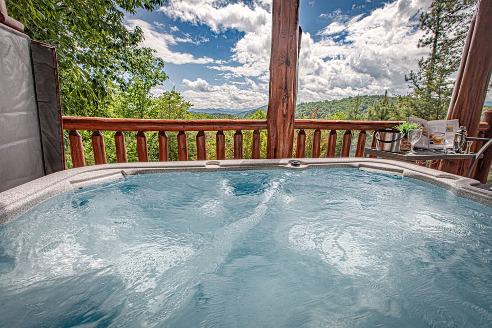 Relax in the hot tub while taking in those mountain views