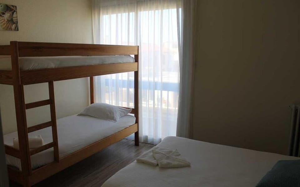 Quadruple Room, Multiple Beds, Partial Sea View | Desk, soundproofing, free WiFi