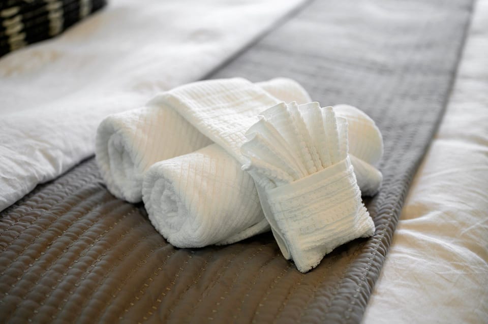 A touch of luxury on a crisp white bed.