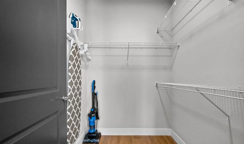 Master Closet Offers Plenty of Storage and a Full Size Ironing Board and Iron. Spill Something? Use the Vacuum to Make the Clean-Up Simple. 