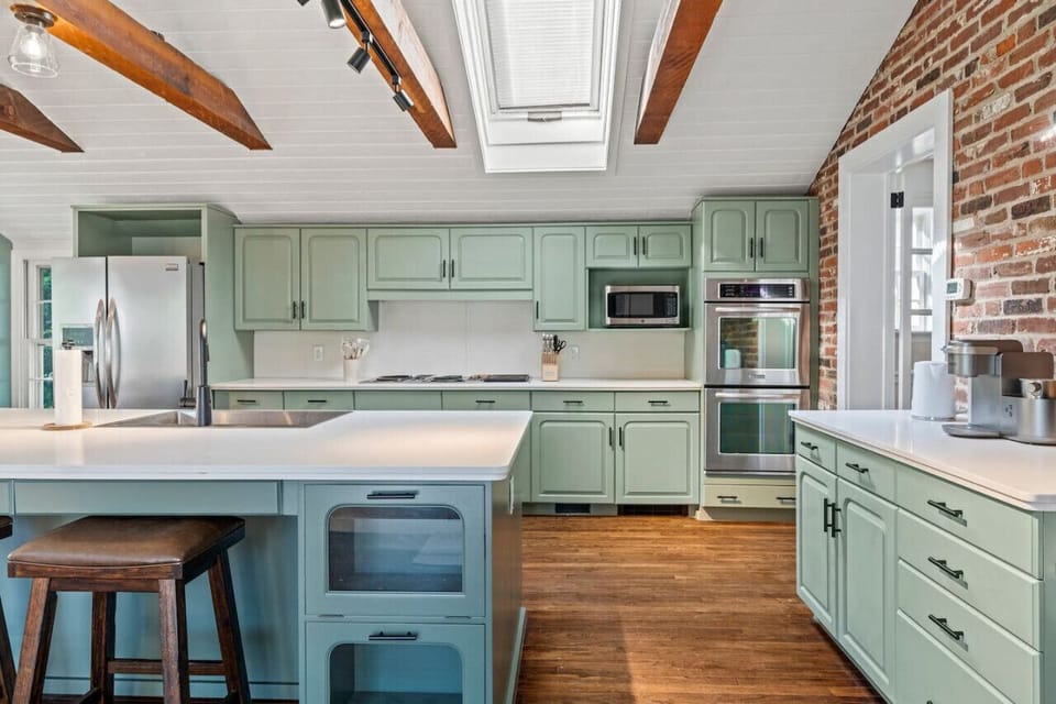 Bright kitchen workspace with ample prep room and natural light