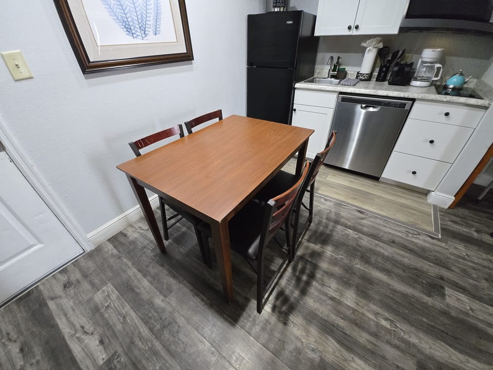 Bright and welcoming table for four—perfect for meals or game nights.