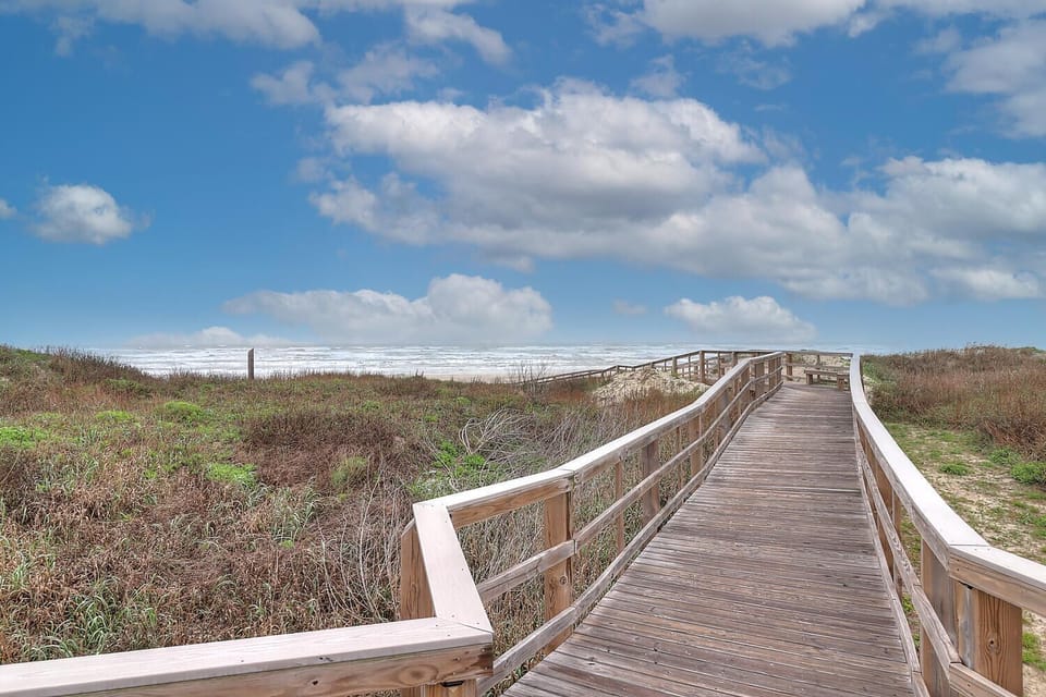 The beach walkover is shared with Coral Cay Condos
