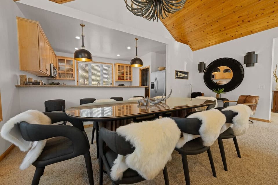 Dining table seats 8 people + barstools and extra seating in the living space