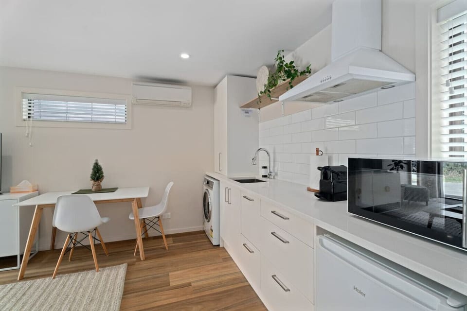 A kitchenette with Fridge, convection/microwave oven, toaster, kettle and Nespresso pod machine for your convenience.