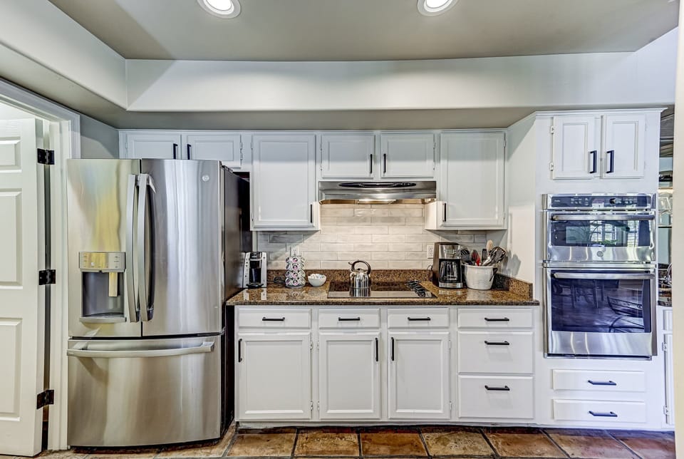 You'll find a fully equipped kitchen with modern appliances, granite countertops, and everything you need for easy at-home meals.