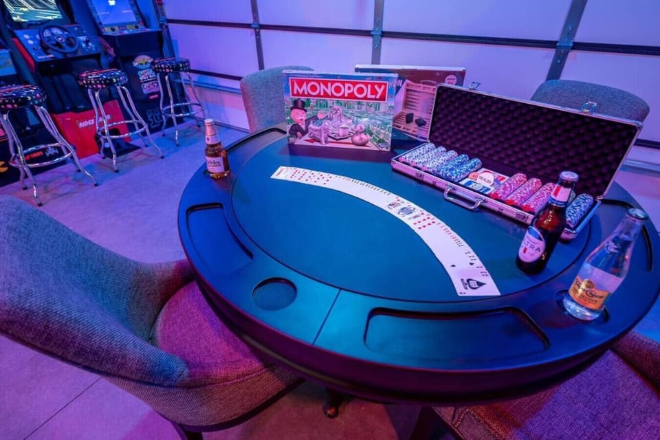Get ready for non-stop fun in this epic game room! With a poker table, shuffleboard, pinball, video games, board games, dice, darts, and even an industrial ice maker and snow cone machine, there`s something for everyone. Let the good times roll