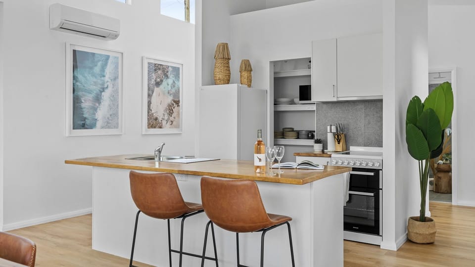 Cook up a storm in this sleek, modern kitchen with top-of-the-line appliances and all the essentials for a culinary masterpiece.