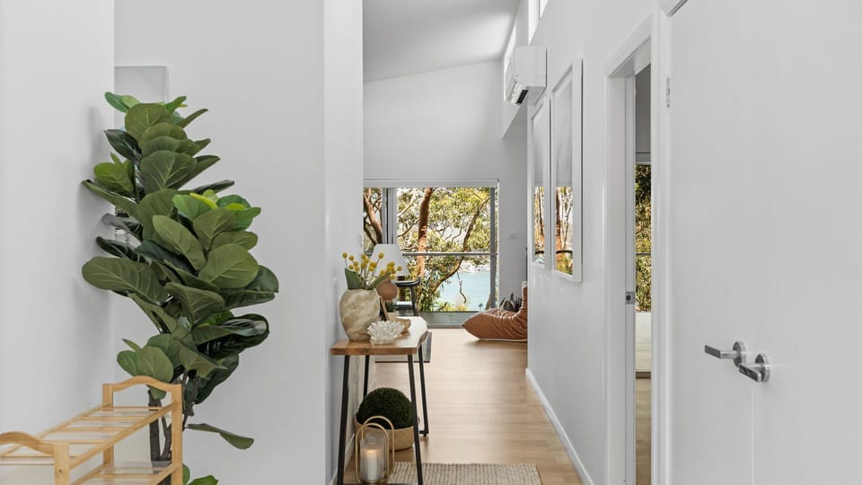 Step into a light-filled hallway that leads you effortlessly to each beautifully designed space, setting the tone for your stay.