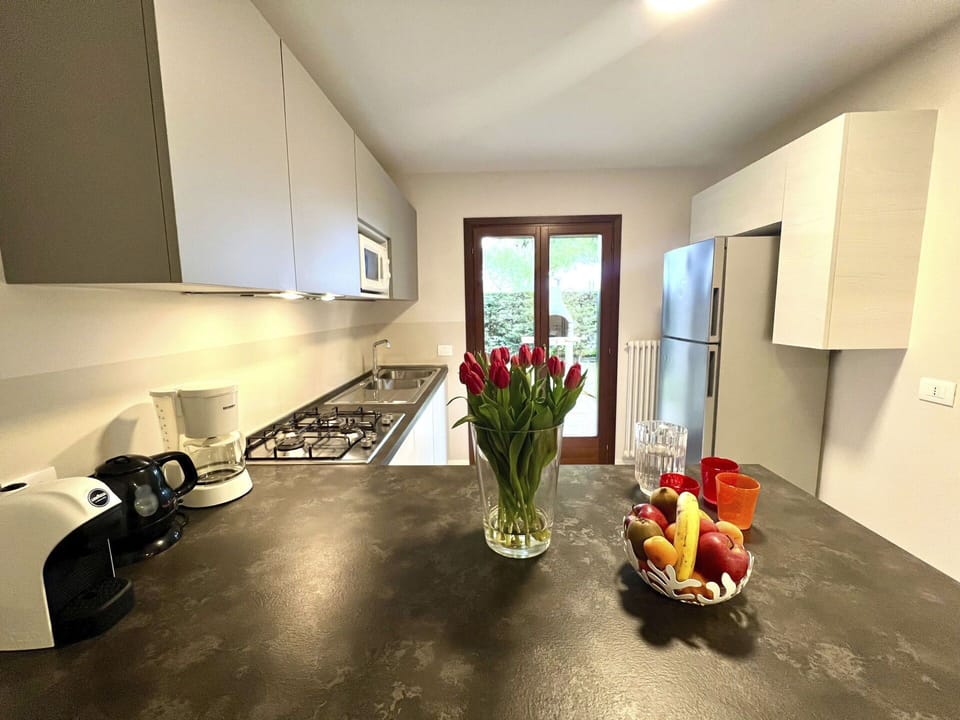 Interior Design, Furniture, Flooring, Countertop, Kitchen, Wood, Kitchen Appliance, Floor, Cabinetry, Room